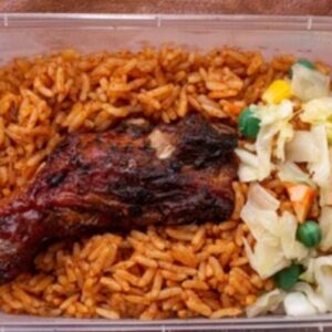 Jollof rice, chicken and salad