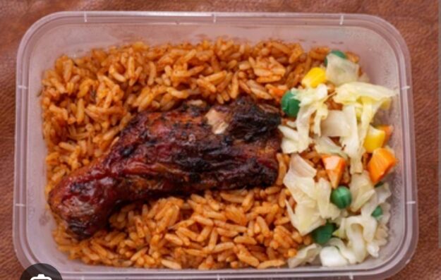 Jollof rice, chicken and salad